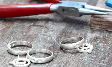 rings on workbench with pliars
