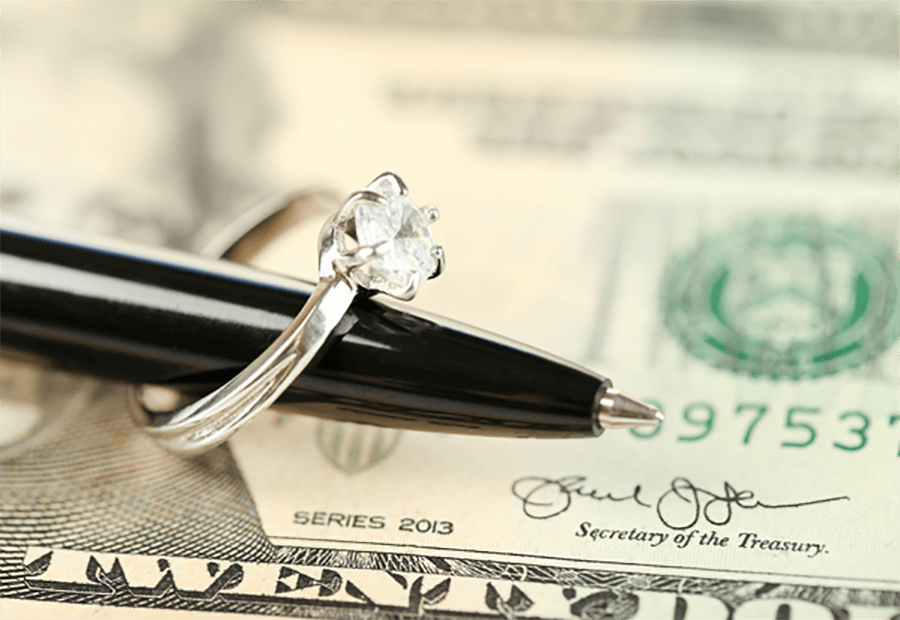ring on pen over cash