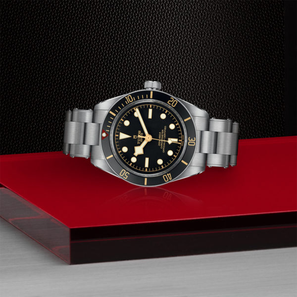TUDOR Black Bay Fifty-Eight Watch with a 39 MM Steel Case, Steel Bracelet (M79030N-0001) Laying Down on Red Tray