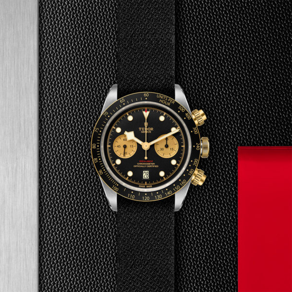 TUTOR Black Bay Pro Watch with a 41mm Steel Case, Black Fabric Strap (M79363N-0003) Flat lay on black and red background