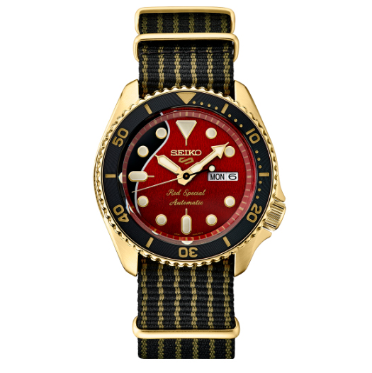 Gold black and red watch with black and gold striped fabric band