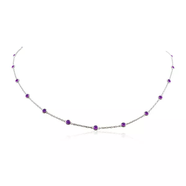 Sterling silver necklace with 22 round bezel set amethyst gemstones.
