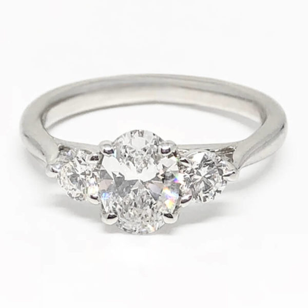 Oval Diamond Ring with 2 Side Round Diamonds