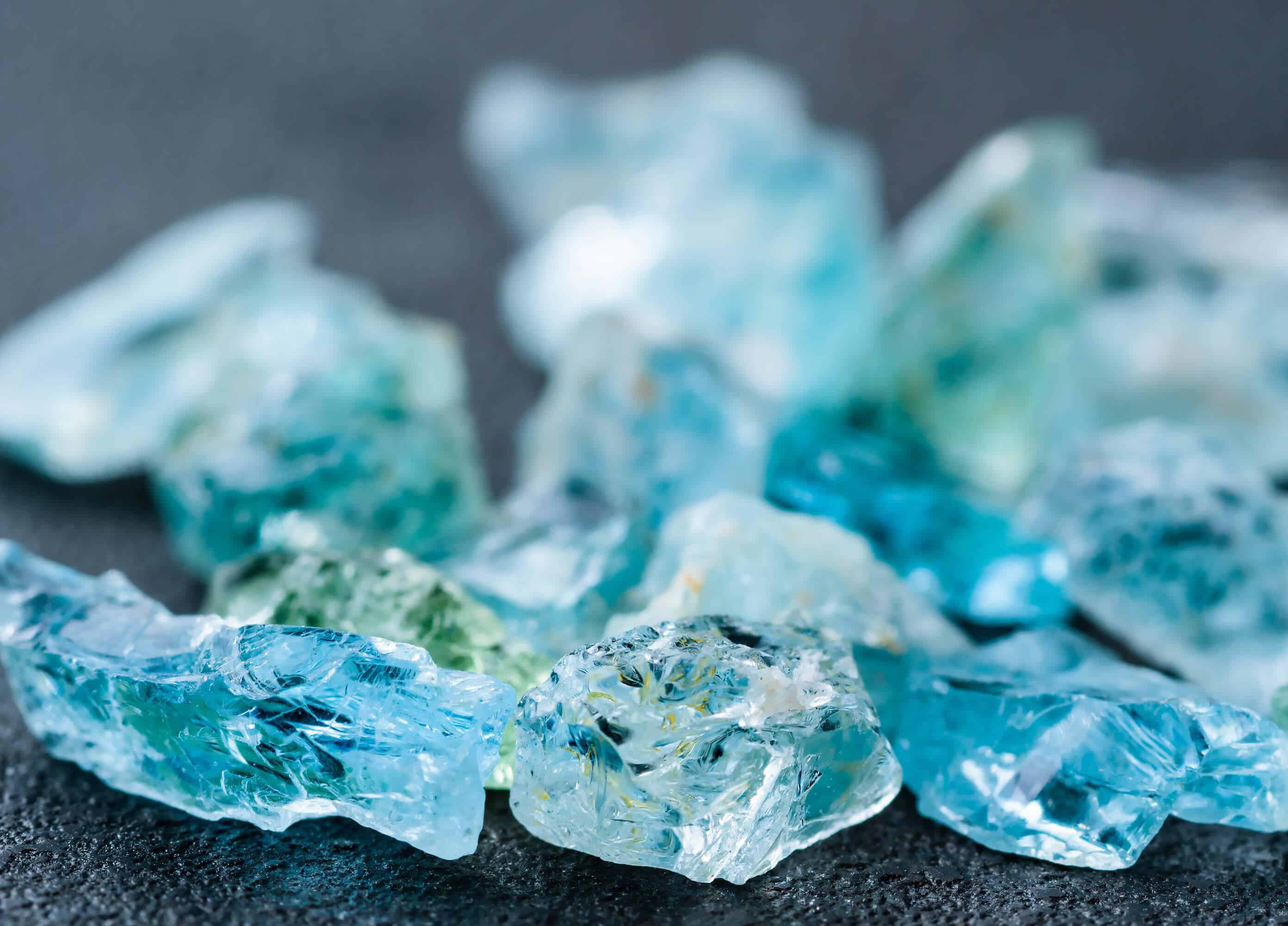 close up image of raw aquamarine gemstones