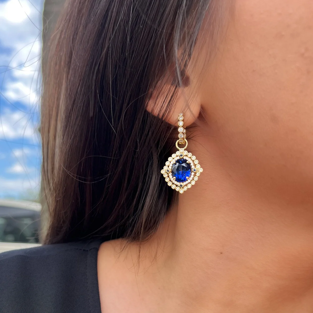 Sapphire earrings on model