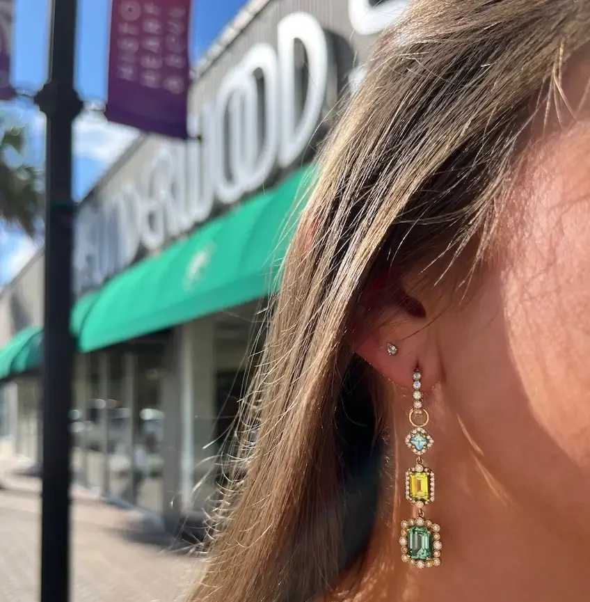 model wearing statement earrings