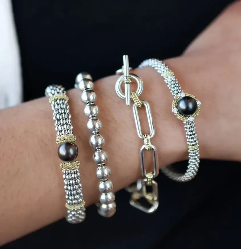 various LAGOS bracelets on model's arm and wrist