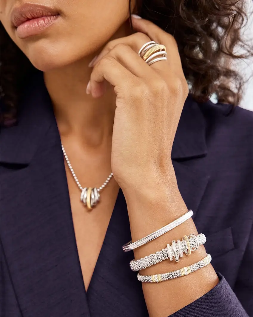 woman wearing multiple LAGOS jewelry pieces