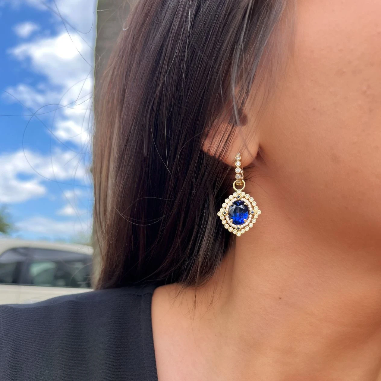Sapphire earrings on model