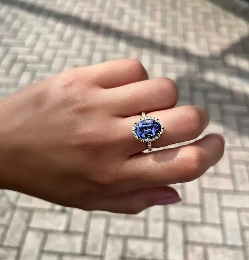 gemstone ring on woman's finger