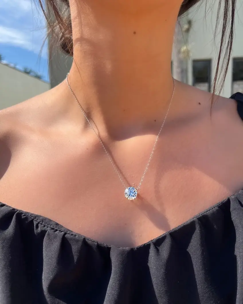 diamond necklace hanging on woman's neck