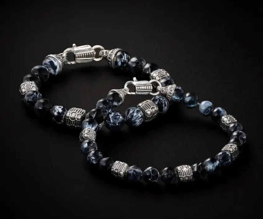 William Henry men's bracelets on black display