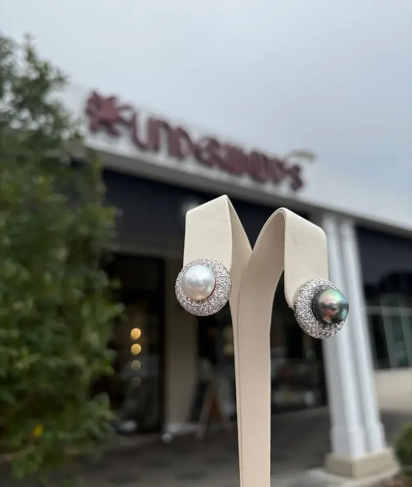 90s two-tone earrings on display outside, Underwood's storefront in background