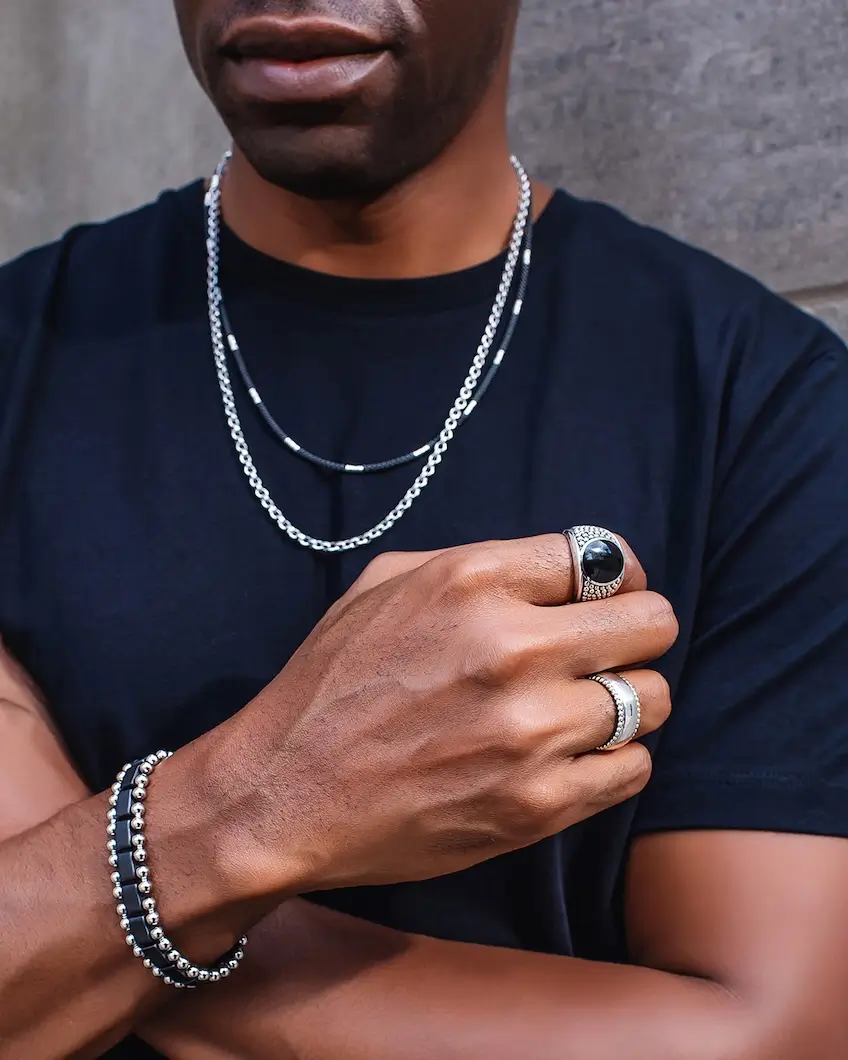 model wearing various pieces from Lagos Men's collection at Underwood Jewelers
