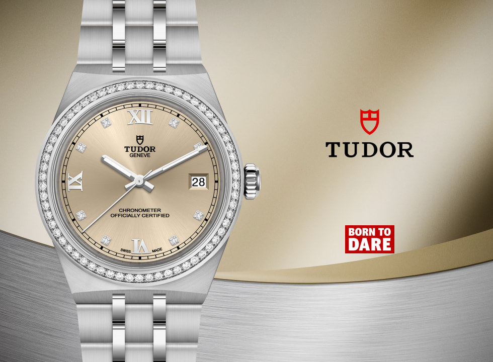 Close-up of a TUDOR Royal watch in stainless steel featuring a champagne sunray dial with Roman numerals and diamond hour markers, a diamond-set bezel, and a matching integrated bracelet. The dial displays the TUDOR Geneva logo, date window at 3 o’clock, and chronometer certification, set against a gold and silver-toned background with the TUDOR shield and “Born to Dare” branding.