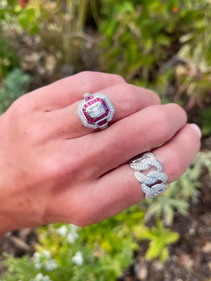 Underwood's ruby birthstone rings on model's fingers
