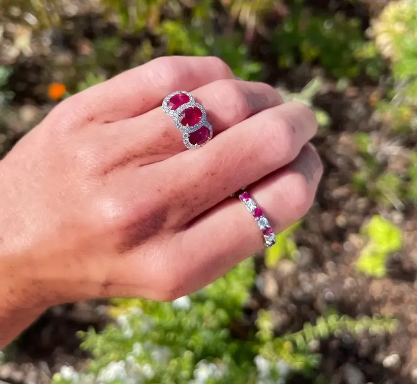 Underwood's ruby birthstone rings on fingers