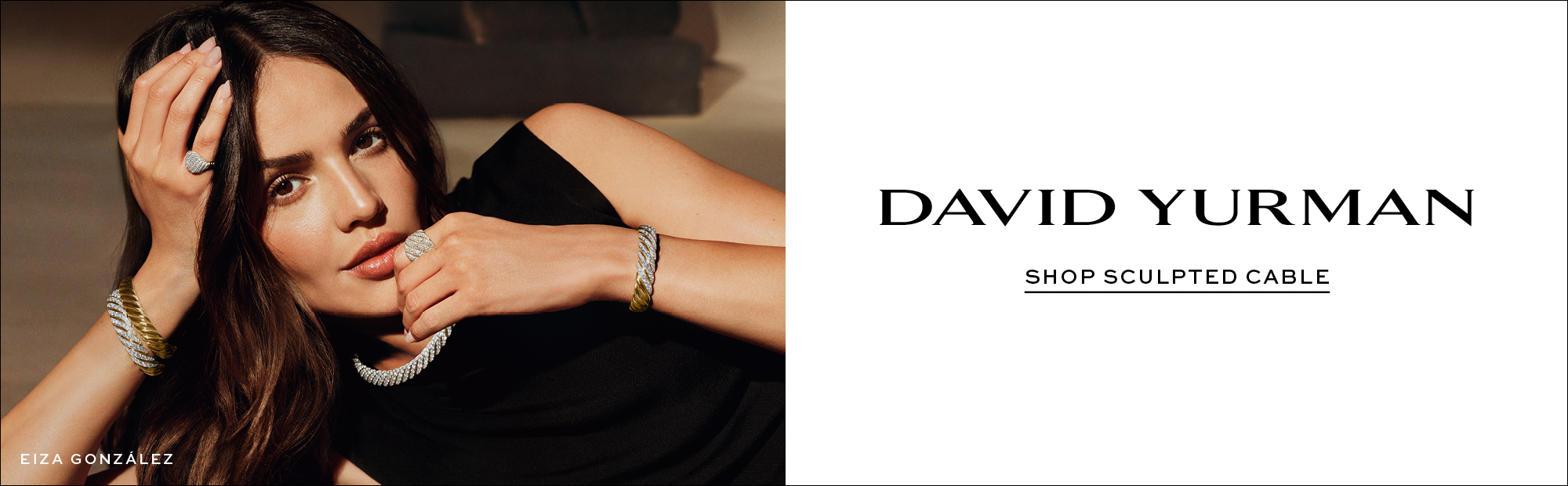 Eliza González wearing David Yurman Sculpted Cable jewelry, including mixed-metal diamond bracelets, rings and a necklace, styled with a black dress.